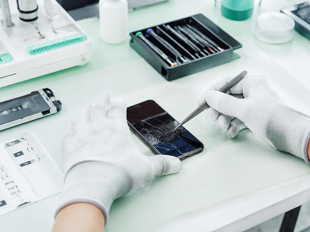 A repaired smartphone with a glowing screen